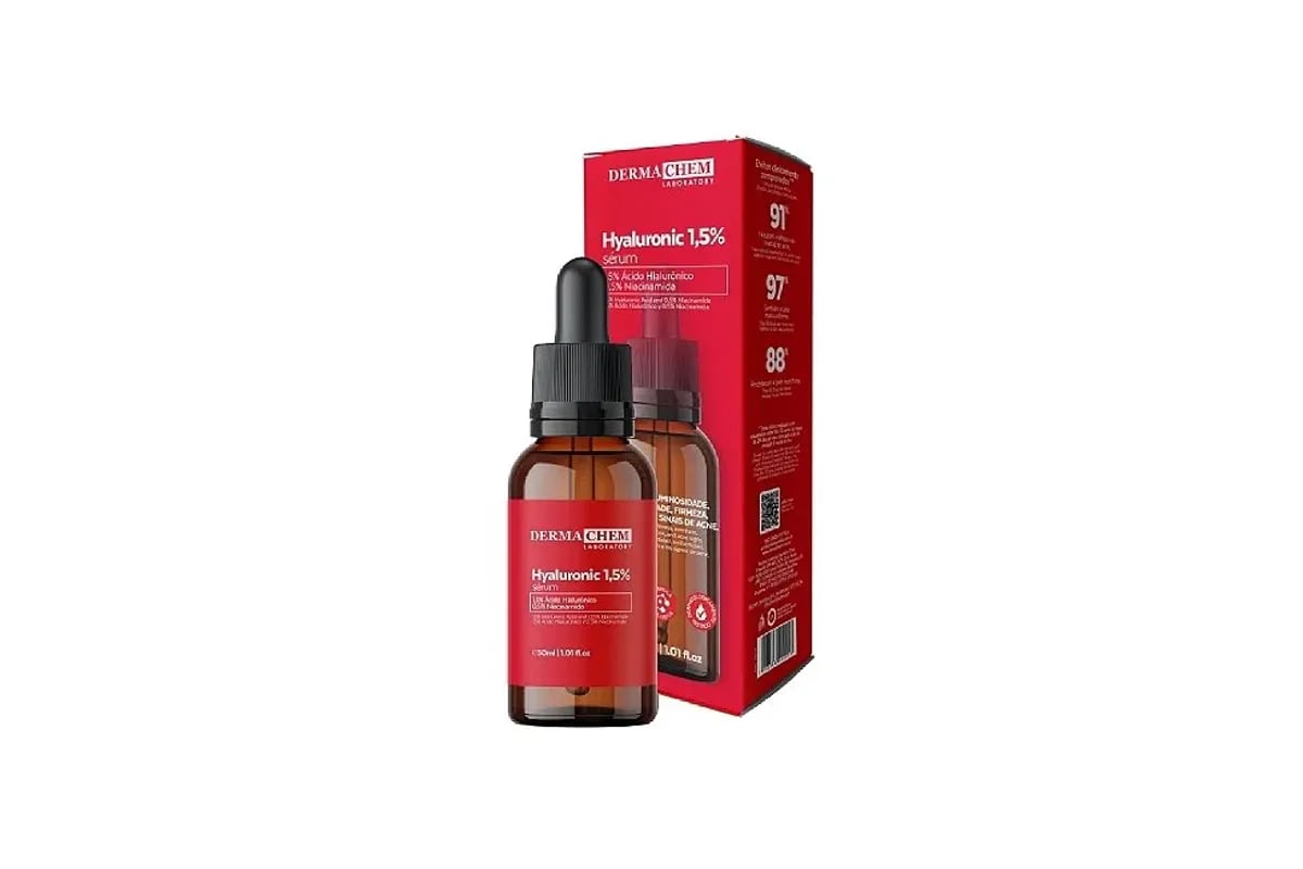 Frasco do Serum Facial Ácido Hialurônico com conta-gotas aberto, uma gota caindo sobre o dorso de uma mão